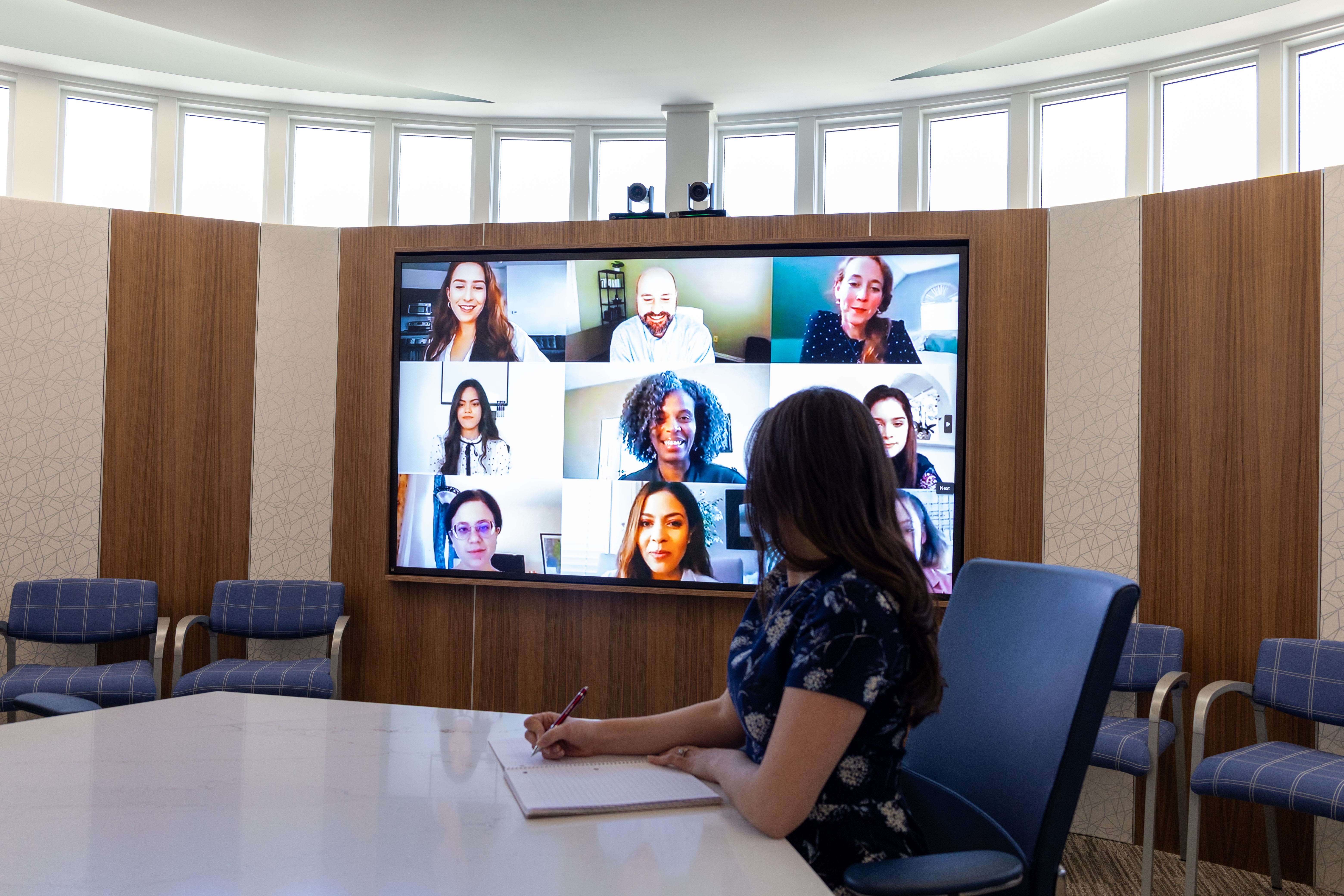 Six-camera video conferencing system providing full-room visibility in a New Jersey corporate boardroom