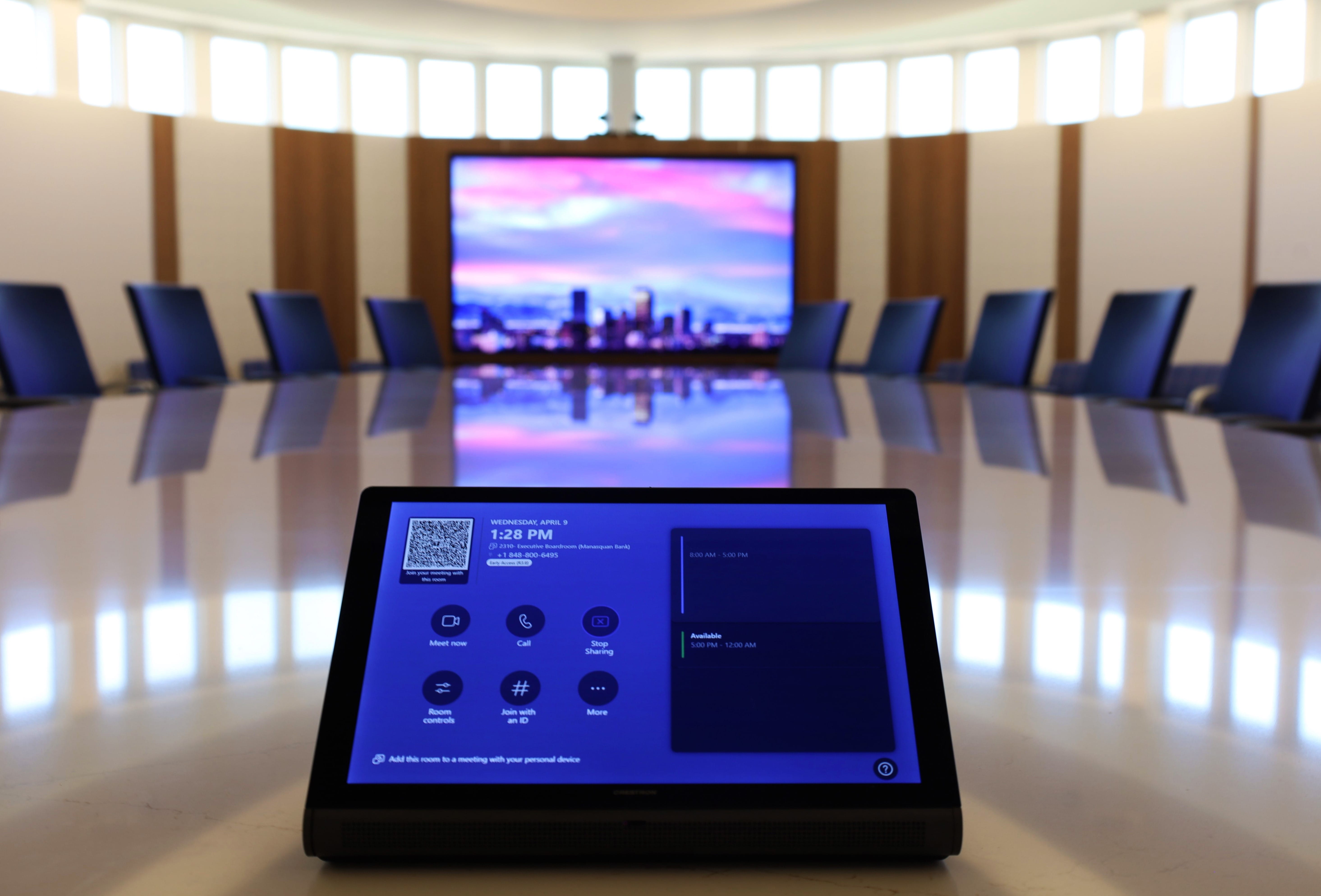 Custom-built AV control panel providing one-touch meeting controls in Manasquan Bank boardroom.