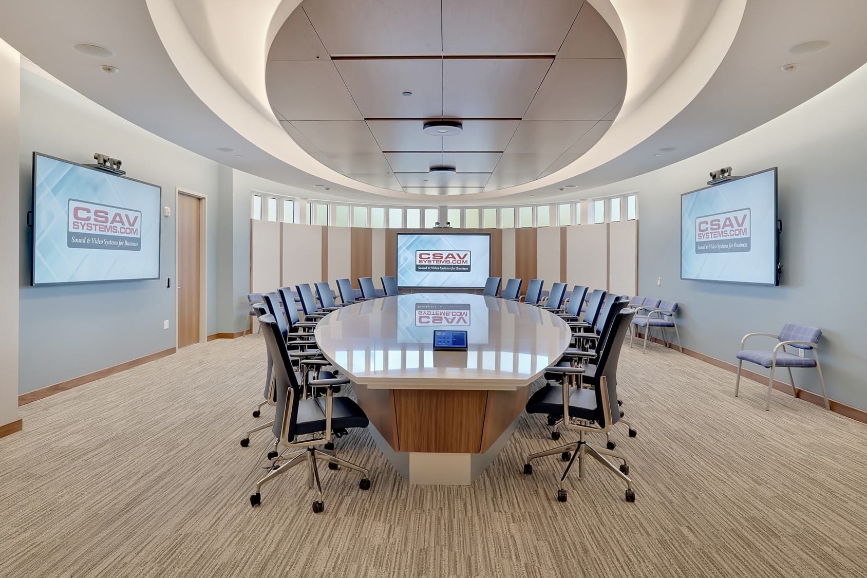 Executive boardroom AV system installed for Manasquan Bank in Wall NJ featuring triple 98-inch displays and conferencing cameras