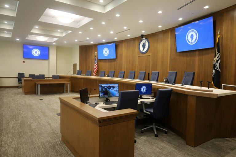 Modern courtroom with AV recording system, multiple displays, and microphones installed by CSAV Systems